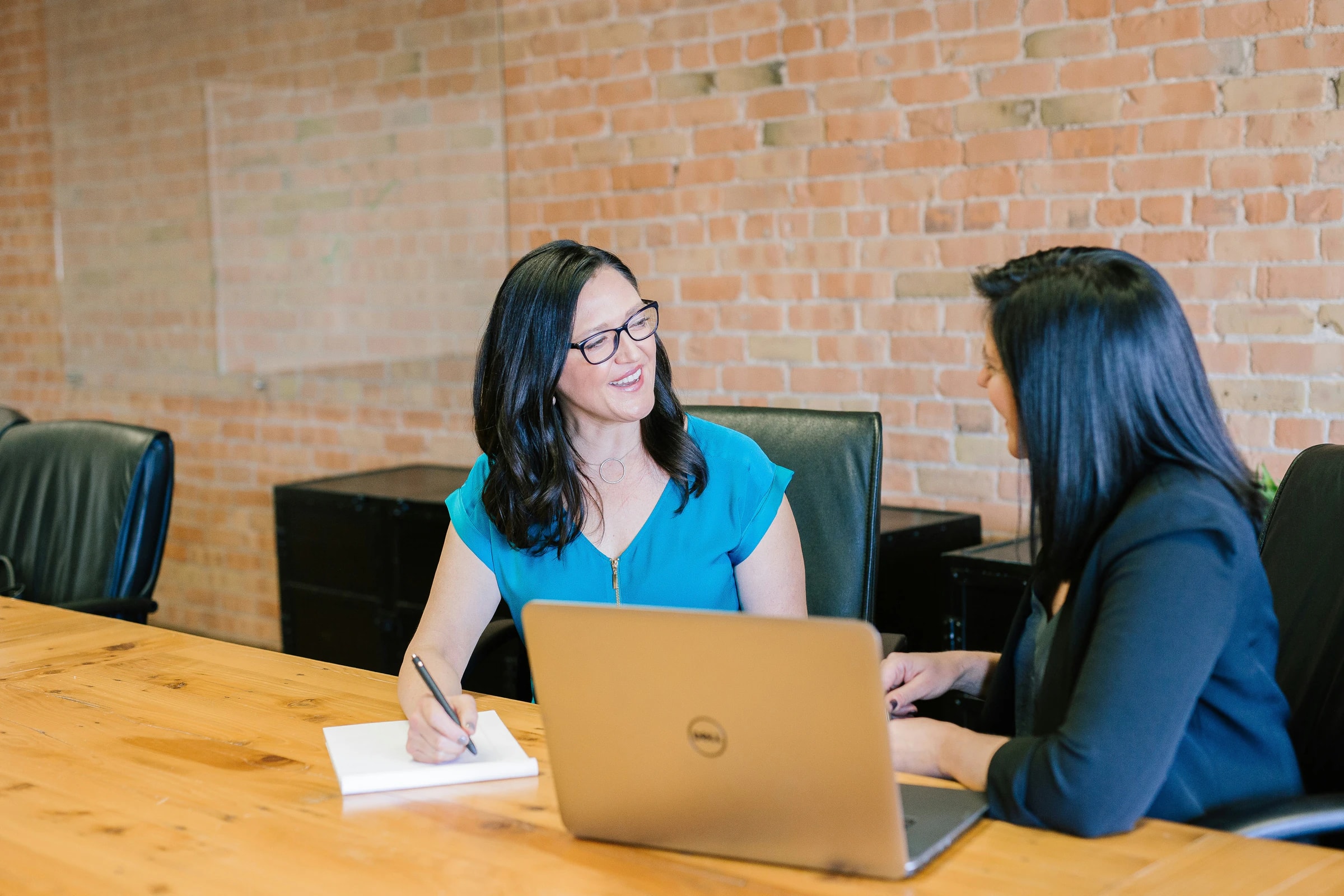 Counsellor advising a student across a desk